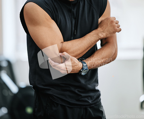 Image of Fitness, gym and injury, man with elbow pain and medical emergency from workout at sports studio. Exercise, health and wellness, bodybuilder with hand on muscle ache while training and arm cramp.