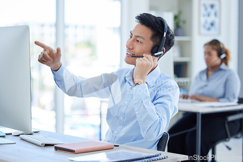 Image of Computer, call center and man talking on headset for telemarketing or sales account information. Asian person reading desktop for database, technical support or online consultation for user email