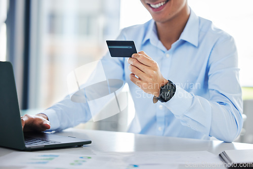 Image of Business man, credit card and laptop in office for online shopping, typing info or payment on internet. Happy businessman, banking and password for cybersecurity with sale, discount or fintech on web