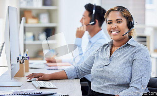 Image of Call centre, portrait and woman smile for telemarketing, customer service or support. Face, contact us and African sales agent, consultant or employee working at help desk, crm and business office.