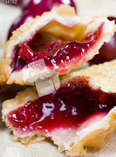 Image of cherry jam in a crispy bun