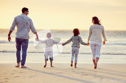 Image of Walking, beach and back of family holding hands on holiday, summer vacation and weekend at sunset. Nature, travel and mother, father and children by ocean for bonding, adventure and quality time