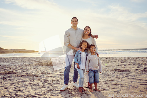 Image of Travel, beach and portrait of parents with children on holiday, summer vacation and weekend. Nature, sunset and happy mother, father and kids by ocean for bonding, adventure and quality time together