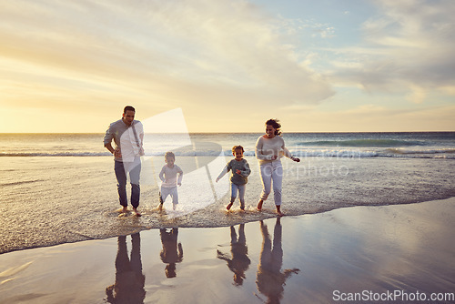 Image of Beach, sunset and parents play with children on holiday, summer vacation and weekend together. Travel, family and happy mother, father and kids run in ocean for bonding, adventure and quality time