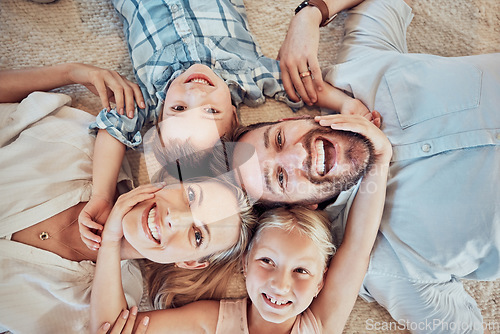 Image of Top view, parents and happy portrait of children for love, care and bonding for quality time together at home. Face of mom, dad and kids for happiness, family and relax in house for fun, joy and play