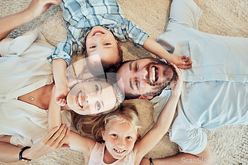 Image of Top view, happy family and portrait on bed for love, care and bonding for quality time together at home. Face of parents, kids and smile for happiness, break and relax in house for fun, joy and play