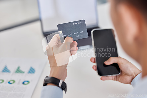 Image of Businessman, hands and phone with credit card for online shopping, banking or finance at office. Hand of man employee or shopper with debit and smartphone for bank payment or ecommerce at workplace