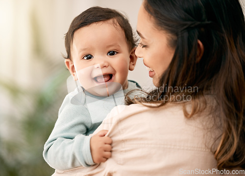 Image of Portrait, baby and mother hug with love, smile and playing during morning bonding routine in their home together. Family, face and mom with toddler in living room having fun, embrace and relax indoor