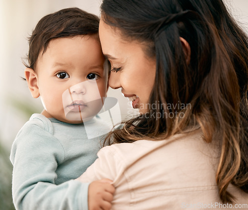 Image of Love, portrait and mother with baby, smile and playing during morning bonding routine in their home together. Family, face and mom with girl toddler in living room having fun, embrace and relax