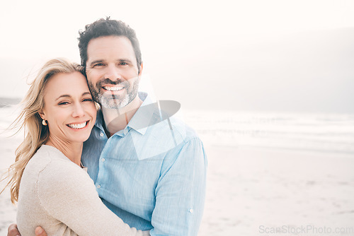 Image of Travel, hug and portrait of couple on beach with smile on holiday, vacation and weekend for anniversary. Love, marriage and happy mature man hugging woman for bonding, quality time and relax by ocean