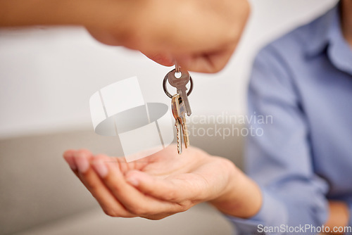Image of Hands, real estate and giving keys to customer after moving into new home. Property agent, realtor and handing over key to owner for sale, loan or mortgage investment in apartment, house or rent.