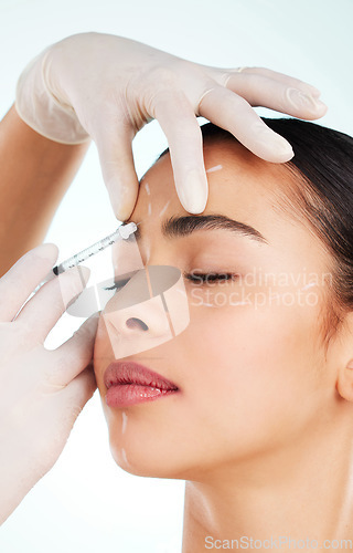 Image of Skincare, woman and face syringe for plastic surgery in studio isolated on white background. Facial, injection and cosmetics of female model with collagen filler for dermatology, beauty or aesthetic.