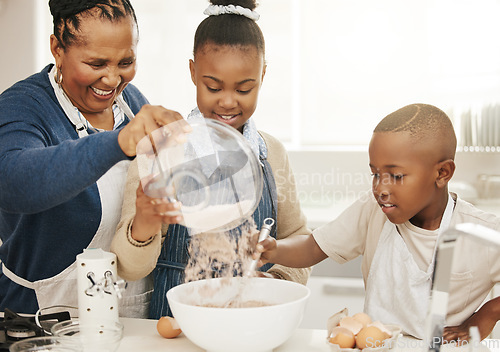 Image of Black family, grandma teaching kids baking and learning baker skill in kitchen with help and support. Old woman with girl and boy are happy, development with growth and bake with ingredients at home