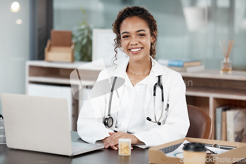 Image of Doctor, woman in portrait and smile, healthcare and medical professional in office with stethoscope and laptop. Female person in medicine, desk and health insurance with cardiologist at hospital