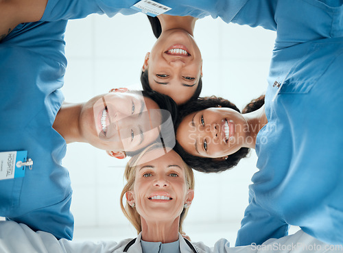 Image of Diversity, teamwork or faces of nurses in huddle with a happy smile collaboration for healthcare goals. Trust, team building or low angle of medical doctors with group support, motivation or mission