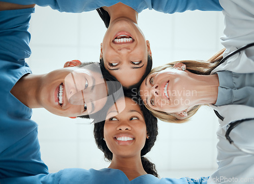 Image of Happy, teamwork or faces of doctors in huddle with a smile collaboration for healthcare mission goals. Smiling, team building or low angle of nurses with group support, motivation or private secrets