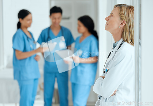 Image of Burnout, anxiety or sad doctor in meeting with nurses with failure, stress or fatigue with medical emergency. Mistake, tired woman or depressed surgeon with depression, trouble or loss in hospital