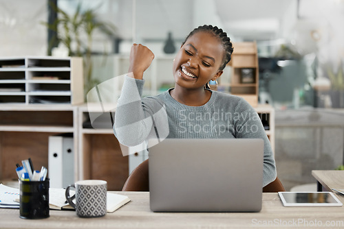 Image of Black woman, laptop and celebration with fist for winning, success or promotion bonus at office. Happy business woman employee in joyful happiness on computer for win, prize or good news at workplace