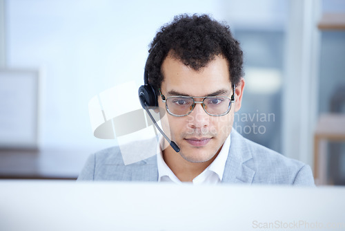 Image of Call center, computer and serious man telemarketing, customer service or technical support email. Contact us, crm and male sales agent, consultant or employee focus on consulting in business office.