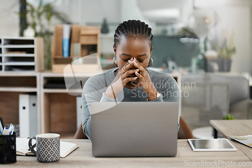 Image of Business woman, laptop and headache in burnout, stress or depression in doubt, fail or mistake at office. Frustrated African female person or employee in anxiety or mental health problem at workplace