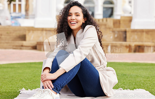 Image of Portrait, woman and college at the park with happiness for education for learning on lawn. Female student, outdoor and grass with a smile for studying at a university with a scholarship for success.