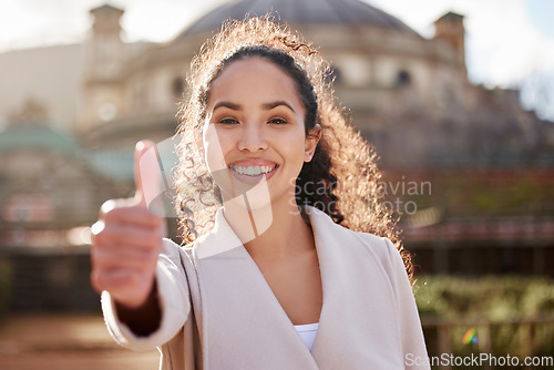 Image of Woman, portrait and thumb up at university in the outdoor with achievement for studying for phd with smile. Female student, agreement and happy with learning in college for scholarship with success.