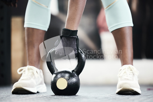 Image of Woman, hand with weightlifting and exercise, kettlebell in gym and strong bodybuilder with muscle training. Sport, workout and bodybuilding, female athlete in fitness studio with challenge and power