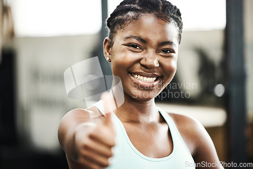 Image of Thank you, portrait of black woman with thumbs up and at gym happy for workout. Success or achievement, support or smile and African female athlete with emoji hand for motivation or fitness.