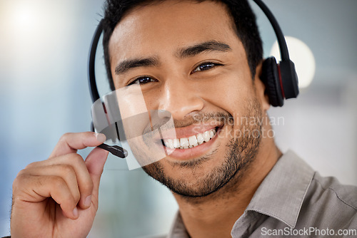 Image of Happy young man, call center portrait and telemarketing with headphones, microphone and communication. Indian guy, customer service agent and tech support for contact us, smile or listening in office