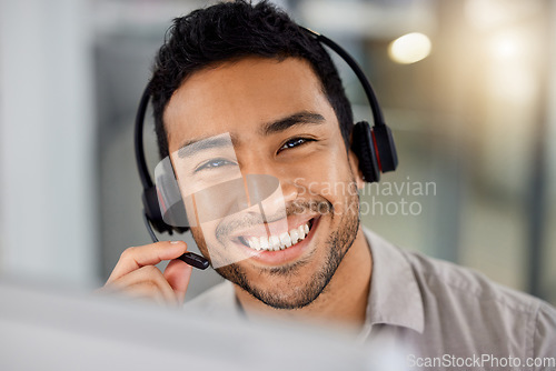 Image of Young man, call center portrait and smile for telemarketing with headphones, microphone and sales. Indian guy, customer service agent and tech support for contact us, happy and listening in office