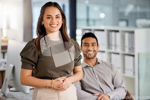 Image of Happy, confidence and portrait of business people in the office in conversation for collaboration. Success, friends and corporate team working together on a project sitting by a desk in the workplace