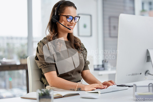 Image of Happy, call center and a woman typing on a computer for telemarketing, consulting and customer service. Smile, contact us and a female sales employee with a pc for communication, support or advice