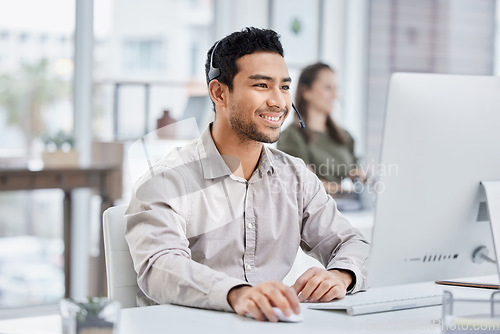 Image of Business, telemarketing and man with a smile, call center and advice with headphones, typing and connection. Male person, consultant and agent with computer, customer service and advice with success