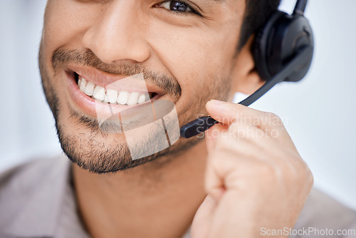 Image of Portrait, call center and Indian man working at office desk, computer or job in telemarketing, communication or sales. Agent, happy employee or work in consulting, customer service or crm business