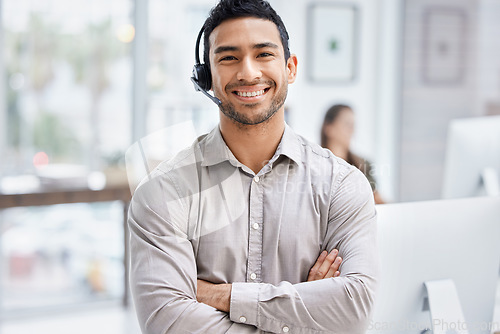 Image of Portrait, customer service and support with a man consultant in his telemarketing office for assistance. Call center, contact us and consulting with a male employee using a headset for retail crm