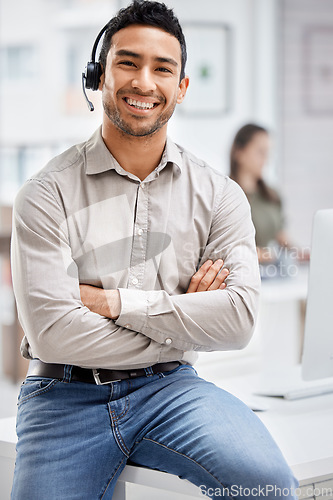 Image of Portrait, customer care and support with a man consultant in his telemarketing office for assistance. CRM, contact us and consulting with a male employee using a headset in a retail call center