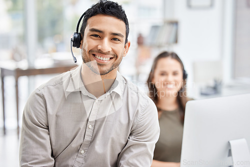 Image of Portrait, call center and support with a man consultant in his telemarketing office for assistance. Customer service, contact us and consulting with a male employee using a headset for retail crm