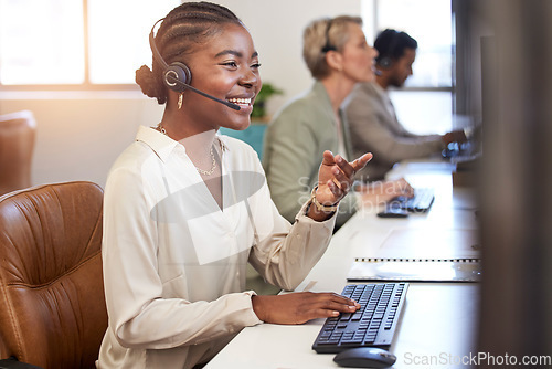 Image of Call center, speaking and business woman in office, agency or ecommerce, talking or client account update. Agent, virtual consultant or african person on computer advice, support or customer solution