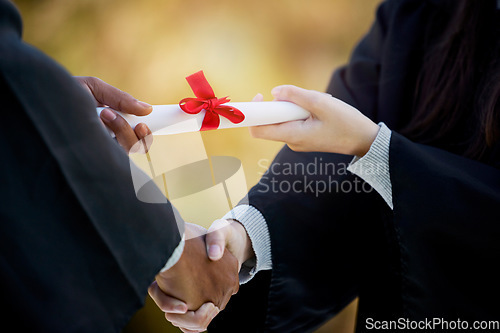 Image of Handshake, graduation diploma and people in success, achievement and congratulations or thank you. Graduate, student or person shaking hands for certificate, excellence and giving award at University