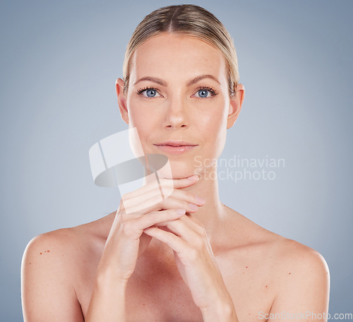 Image of Beauty, skincare and natural with portrait of woman in studio for facial, cosmetics and makeup. Self care, wellness and mockup with face of model on grey background for glow, luxury and collagen