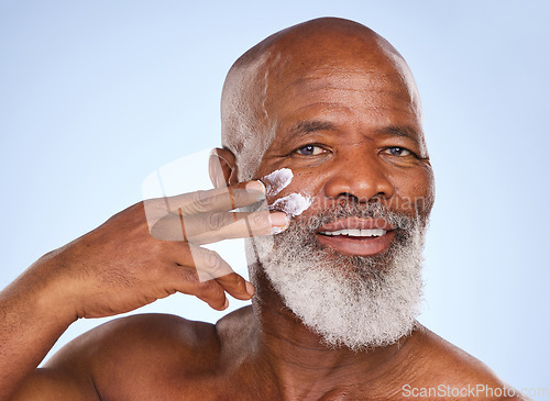 Image of Skincare, cream and sunscreen with portrait of black man in studio for spa, anti aging or beauty. Cosmetics, mockup or self care with face lotion on model on blue background for facial and product