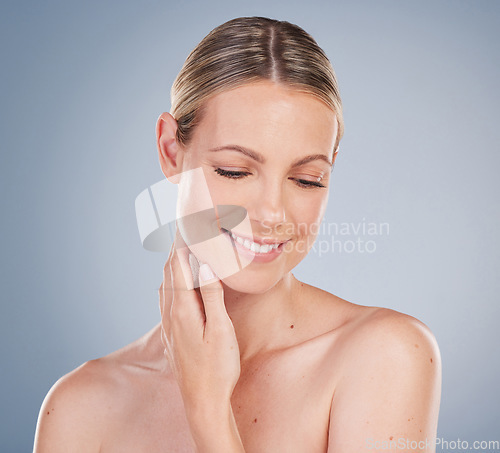 Image of Skincare, beauty and happy woman isolated on studio background thinking of natural makeup, skin glow and shine. Young model or person with foundation or dermatology results, facial and cosmetics idea