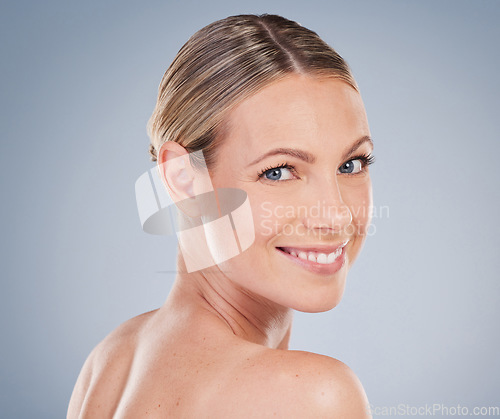 Image of Beauty, skincare and makeup with portrait of woman in studio for facial, cosmetics and natural. Self care, wellness and mockup with face of model on grey background for glow, happiness and collagen