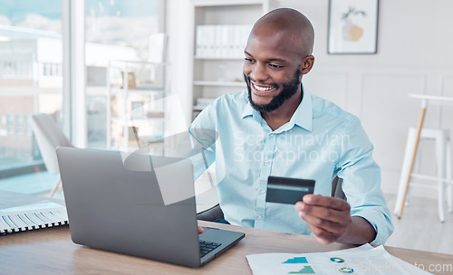 Image of Credit card, online shopping and black man use laptop, internet or web for ecommerce purchase in an office. Businessman, African and employee making payment on a website in a company office