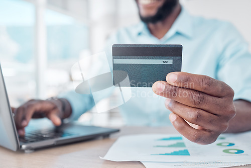 Image of Credit card, payment and person online shopping with laptop, internet or web for ecommerce purchase in an office. Digital, African and business man or employee pay on a website in a company