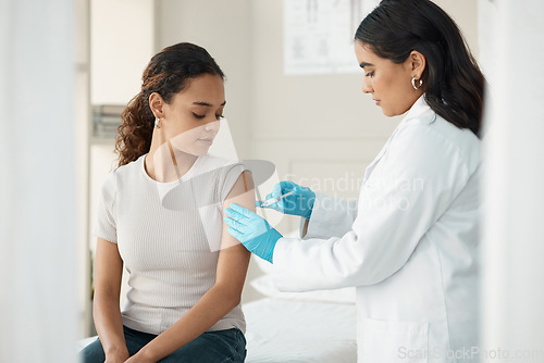 Image of Healthcare, vaccine and patient with injection for consultation about virus and treatment. Doctor, needle and consulting for vaccination and wellness with help at the clinic with gloves for safety.