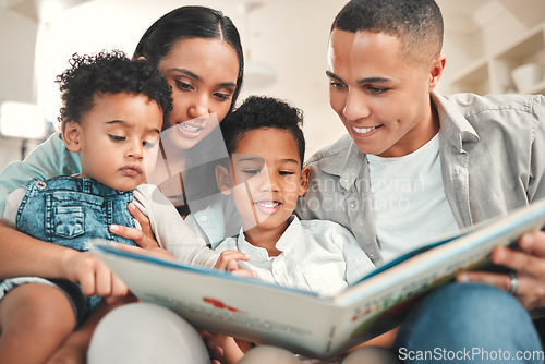 Image of Young happy family, kids reading and couch for story, book and learning together in home, love and bonding. Parents, education and children on living room sofa with smile, care and support in house