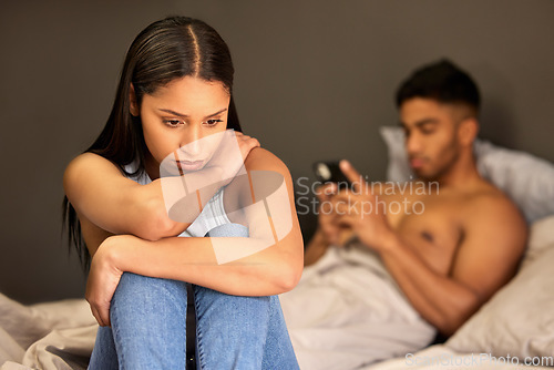 Image of Sad woman, couple fight and man typing with digital affair, relationship problem and depressed in bed. Breakup, divorce talk and cheating with female person feeling stress and guilty in home bedroom