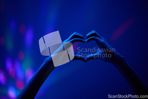 Image of Lights, heart hands of fan at party or concert at night, stadium lighting and bokeh with mock up. Music festival, love hand sign in silhouette and live performance show with neon light in arena space