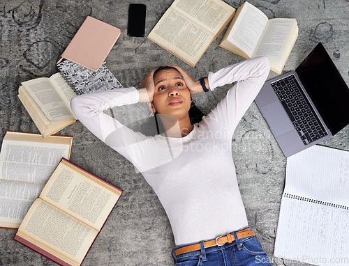 Image of Study anxiety, burnout and woman student on ground with textbook for test feeling overworked. Stress, female person and home studying for university exam and course with laptop for elearning online